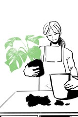 植物を植え替えする女性