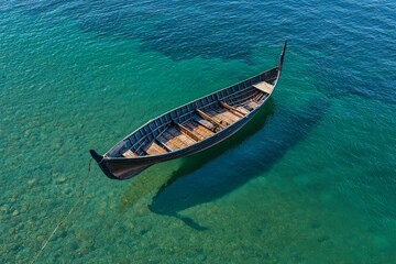 Fototapeta premium Aerial view of a traditional boat in the paradisiacal sea.