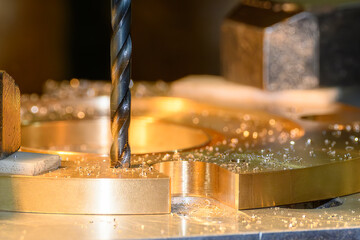 The hole drilling  process on NC milling machine with brass ring parts.