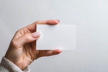 Obraz premium Woman holding something blank surprised isolated on a white background.