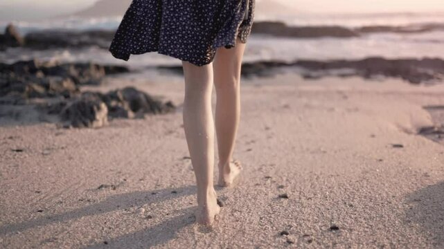 Girl feets walking on the dust ground in sunrise 4k video