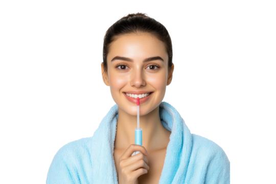 Happy woman in a blue bathrobe applying lip gloss, isolated on transparent background