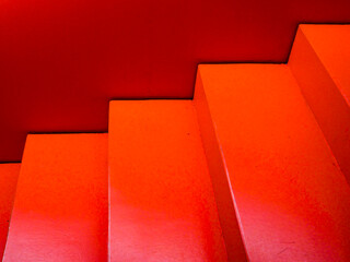 Red staircase with red wall.