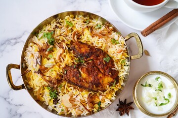 Homemade King fish biryani served with yogurt