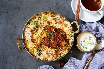 Homemade King fish biryani served with yogurt