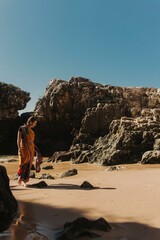 Indian woman in traditional saree clothes dances traditional dances on the nature with the ocean on...