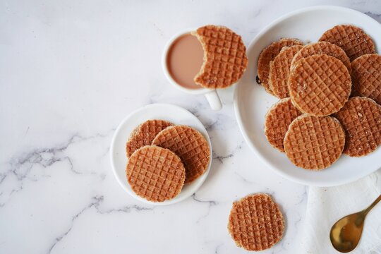 Mini Stroopwafels with a cup of hot tea,  selective focus