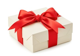 Fototapeta premium A beautifully wrapped cream colored gift box tied with a vibrant red satin ribbon and bow