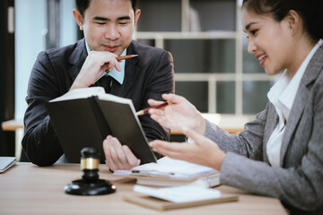 Lawyer Legal counsel presents to the client a signed contract with gavel and legal law. justice and lawyer Business partnership meeting concept.