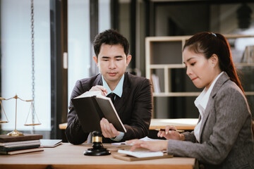 Lawyer Legal counsel presents to the client a signed contract with gavel and legal law. justice and lawyer Business partnership meeting concept.