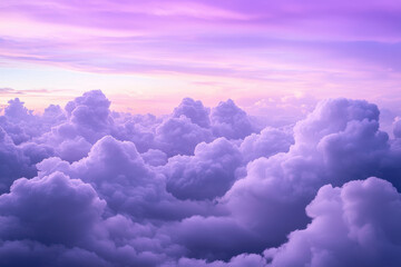 Serene view of fluffy purple clouds during sunset, evoking peace and calmness.