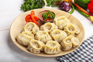 Steamed Nepali dumpling Momo with sauce