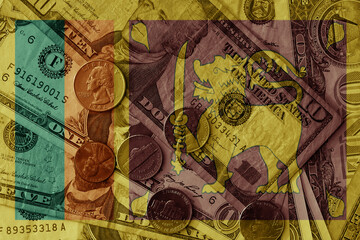Fototapeta premium colourful flag of sri lanka on a dollar money banknotes and coins background. finance concept. macro shot