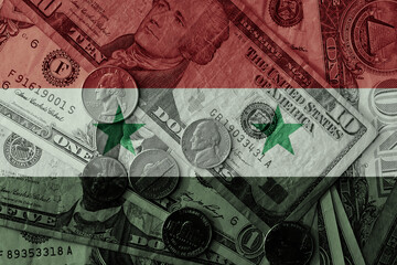 colourful flag of syria on a dollar money banknotes and coins background. finance concept. macro shot