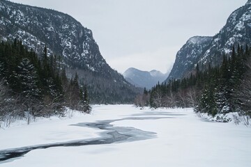 Serene winter landscape showcasing a frozen river surrounded by majestic mountains and evergreen trees