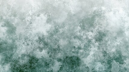 Obraz premium Abstract textured background with shades of gray and green. The image features a mottled, speckled effect with varying densities of color and