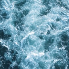 Obraz premium Turbulent ocean surface with foamy waves and deep blue hues creating a dynamic water texture