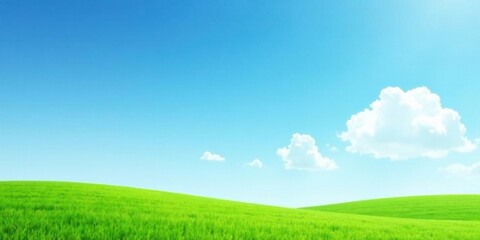 Obraz premium Serene Landscape Featuring Rolling Green Hills Under a Bright Blue Sky with Puffy White Clouds