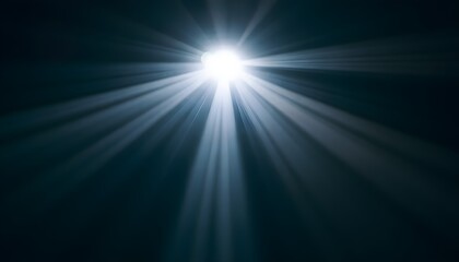 A beam of white light cutting through a dark space, creating a dramatic and atmospheric scene with soft rays extending outward.