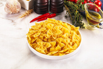 Raw dry Italian pasta - farfalle