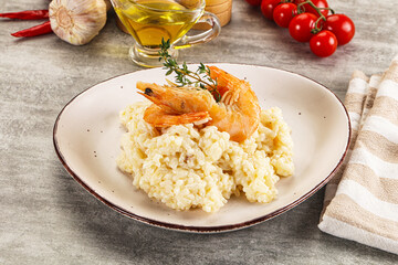 Italian risotto with prawn served thyme