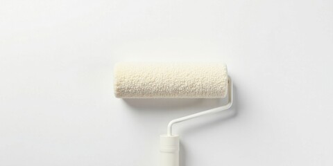 Fototapeta premium A pristine white paint roller rests on a smooth, even surface, ready for a fresh coat