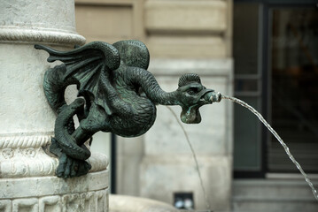 Closeup of bronze dragon fountain in Basel in switzerland
