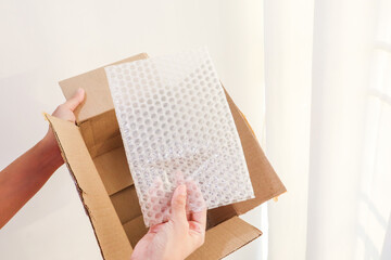 Bubble wrap for protection product cracked in cardboard box.