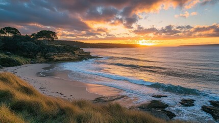 Fototapeta premium Vibrant sunset captured at the perfect moment, with crashing waves and a glowing horizon on a sandy beach