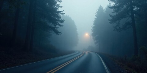 Serene Winding Road Through Misty Forest at Dusk with a Single Illuminated Streetlamp