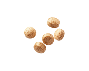 Five small, round, beige tablets arranged on a plain background.