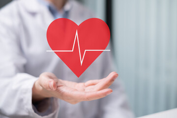 Professional healthcare medical worker holding red heart with cardiogram cardiologist concept