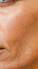 Fototapeta premium Facial skin texture concept. Extreme close-up of mature skin texture, emphasizing the depth of wrinkles and natural imperfections, soft shadows, sharp detail