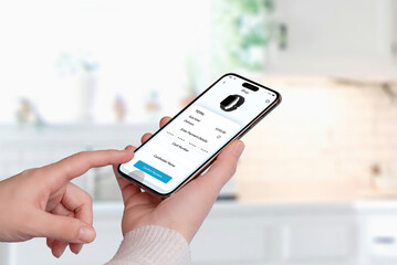 Smartphone screen displaying a purchase confirmation for a smartwatch. A hand taps 'Confirm Payment,' with credit card details and product image visible