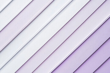 Obraz premium Abstract diagonal lines of purple and white wooden planks creating a textured background for design