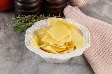 Parmesan cheese slices in the bowl