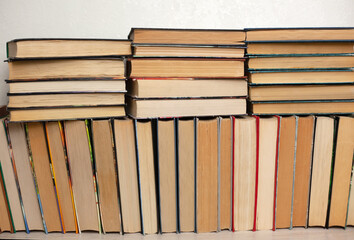 Folded old paper books. Library stacks of old books, bookstore. The concept of learning, reading and cognition, thirst for knowledge. the culture of reading