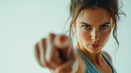 Motivational fitness woman pointing with determination highlighting personal choice and empowerment in pursuing a healthy lifestyle