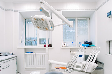 Modern dental equipment in dentist clinic. Dentists tools for treatment and surgery of teeth. Special medical instruments.