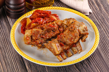 Baked lamb ribs with vegetables