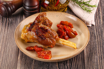 Baked lamb shank with vegetables