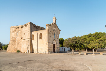 Church of San Pietro in Bevagna with medieval Tower, located in the center of San Pietro in Bevagna village, province of Taranto, Italy.