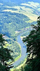 Panoramic view from Mount Trzy Korony to mountains, forests, and the Dunajec River in Pieniny National Park, Poland. Ideal for travel, hiking, and nature photography themes. Vertical © Krystsina_Semianiuk