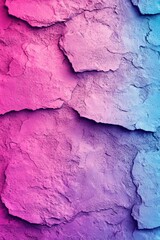Textured rock surface with a gradient of pink and blue hues creating a vibrant abstract pattern