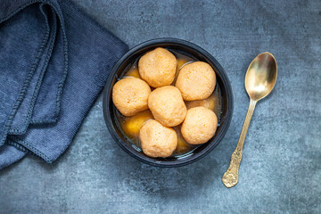Delightful Nolen Gurer Rosogolla,  A Traditional Bengali Sweet Infused with the Rich Flavor of Date Palm Jaggery