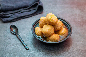 Delightful Nolen Gurer Rosogolla, The Rich, Aromatic Bengali Dessert Infused with Date Palm Jaggery, A Timeless Culinary Treasure