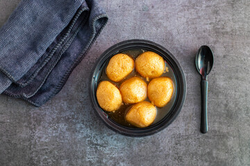 Delightful Nolen Gurer Rosogolla,  A Traditional Bengali Sweet Infused with the Rich Flavor of Date Palm Jaggery