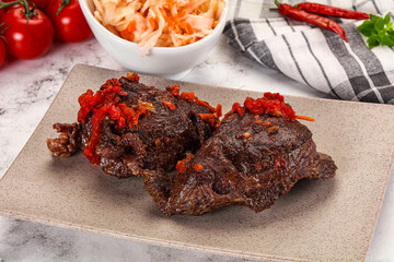 Baked beef cheeks with vegetables