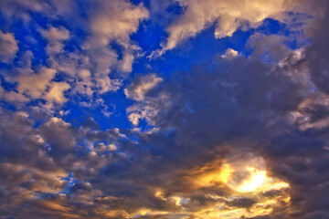 Evening sunshine background with clouds dramatic sky.