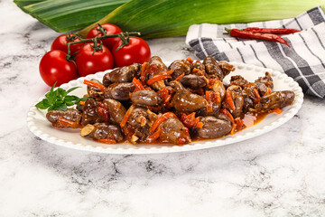 Baked chicken hearts with vegetables